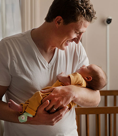 father holding baby